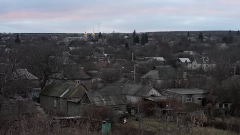the sun sets on a village near the frontline in the donbas region of ukraine. a somber and quiet end to another day in the ongoing war against russia