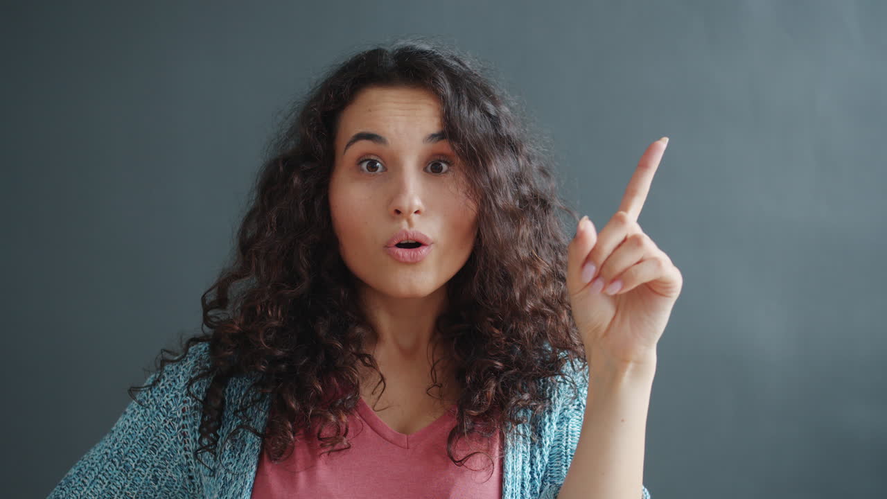 Woman Thinking and Pointing