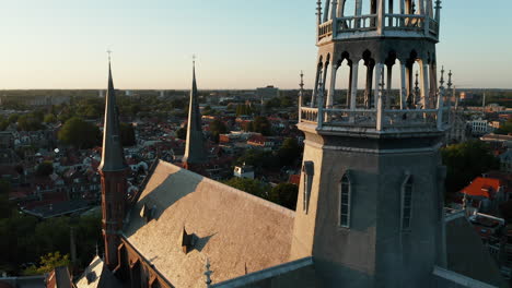 aerial view of the neo-gothic exterior of the church spire of gouwekerk in gouda, south holland