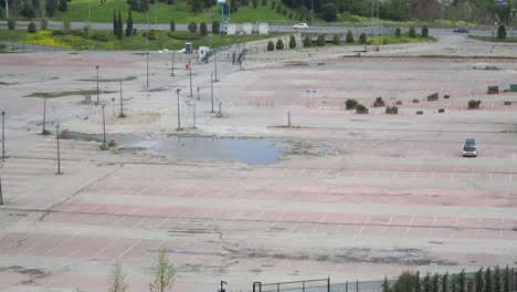 empty parking lot with puddles