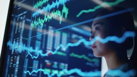 woman analyzing financial data on a computer screen