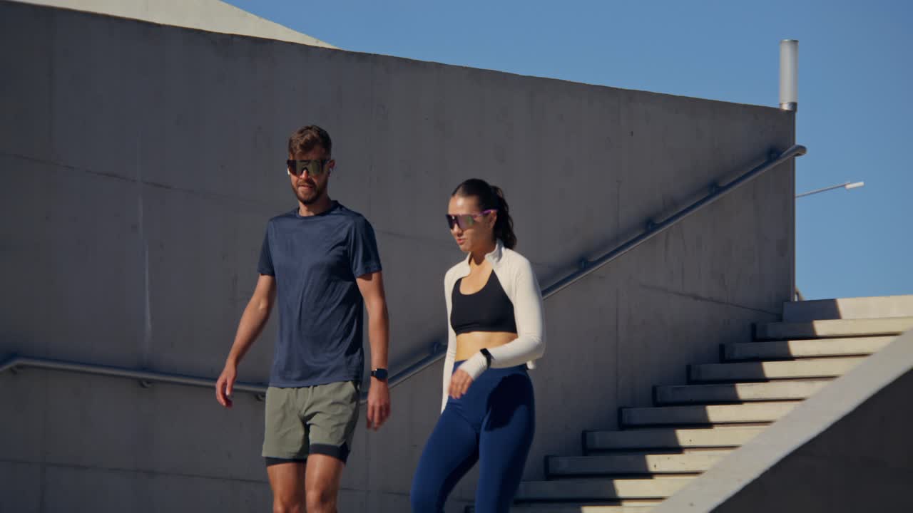 Couple exercising outdoors on stairs