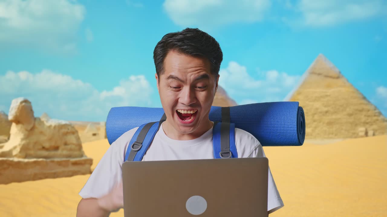 Excited Traveler Working on Laptop in Egypt