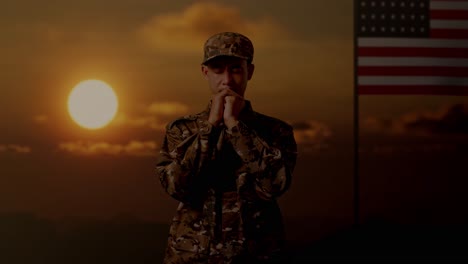 asian man army soldier uniform praying with flag of the united states, sunset time