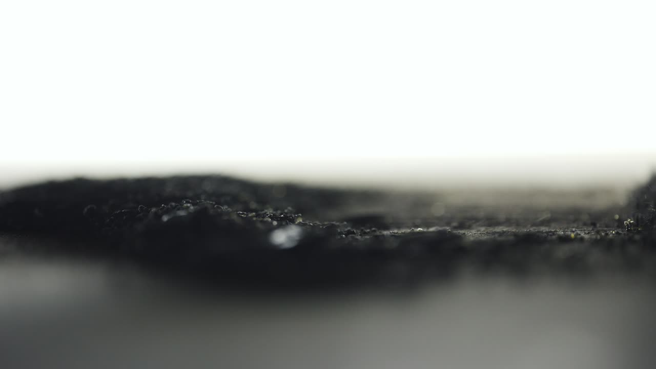 Volcanic Sand Moving With Magnetism Under Macro Lens
