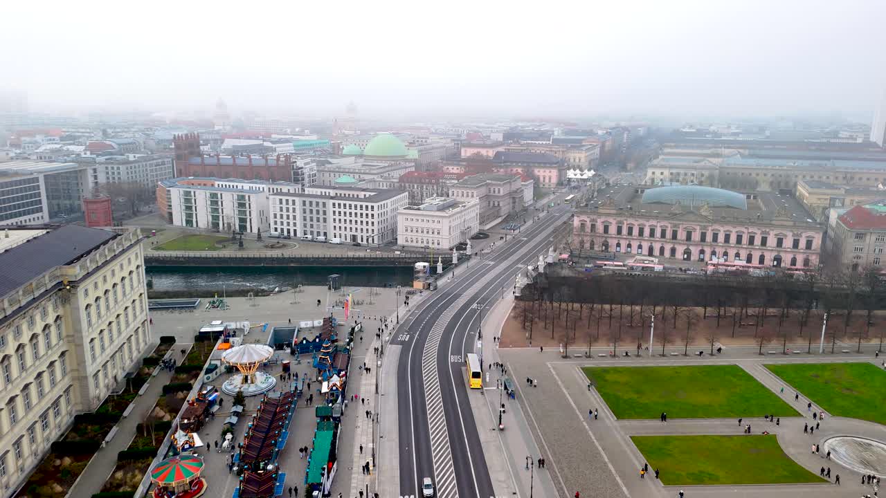 Explore the dynamic city center featuring busy streets and a lively park area. Cloudy skies add a unique backdrop to the diverse activities and urban landscape