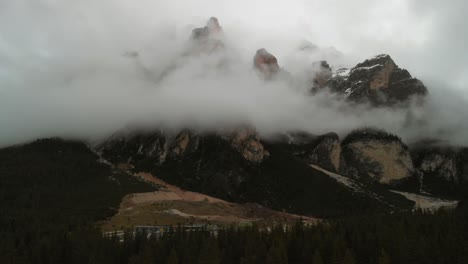 aerial shot of a cloudy day in the italian alps