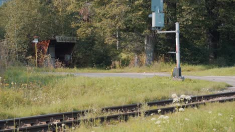 empty train station in bacuch, slovakia, static wide shot of rural railway, day