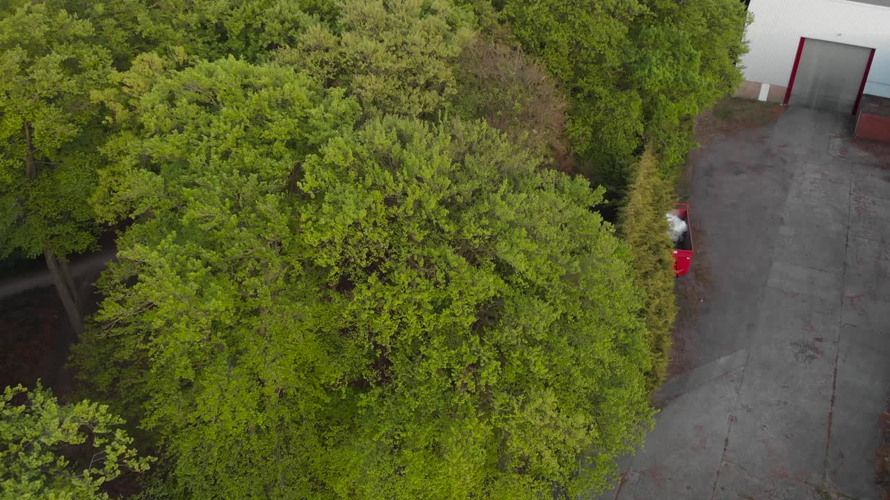 Rising clip over a small forest during Spring in the rural area of England