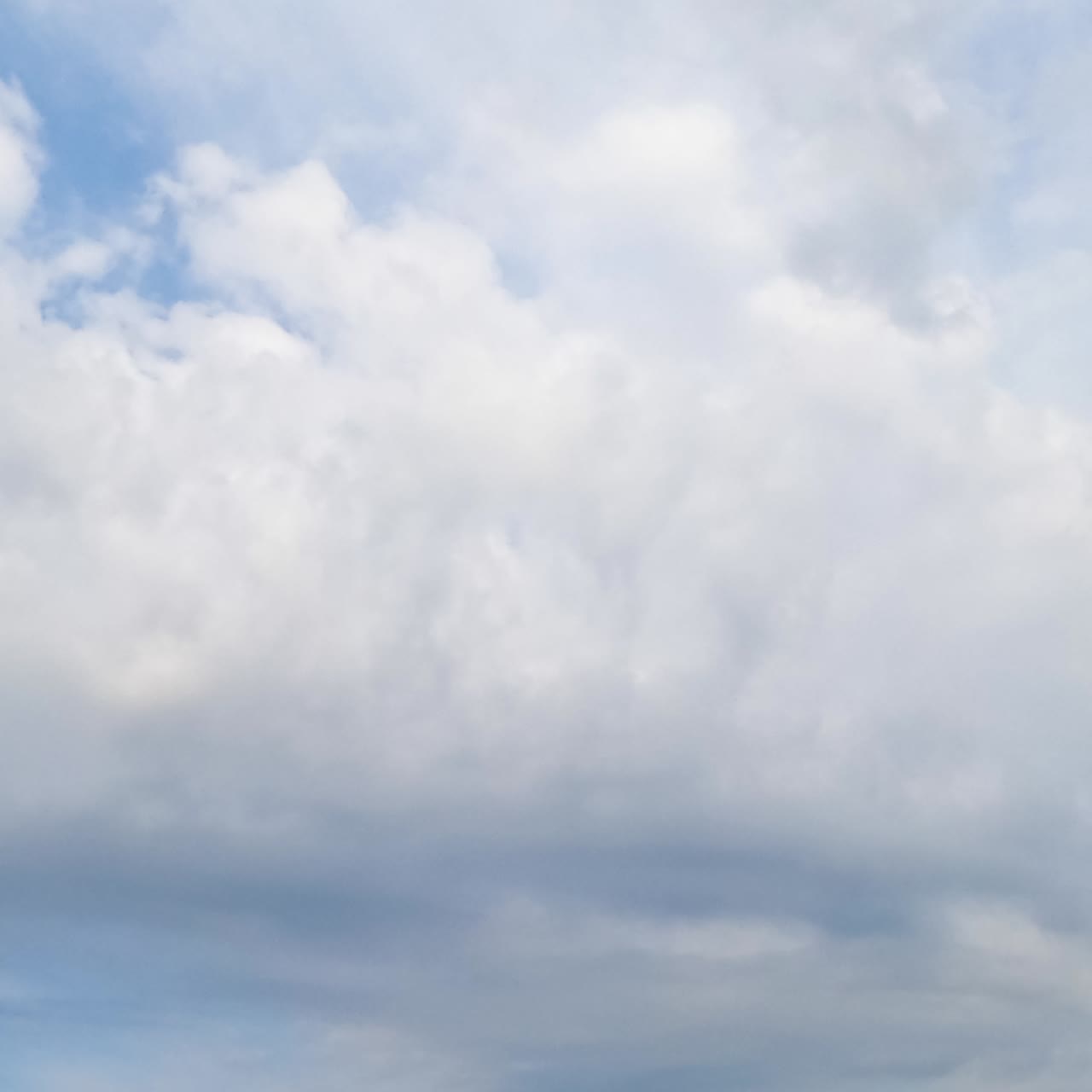 Blue skies being covered with light white cloudscape. Summer sky with cloudscape formation. Timelapse