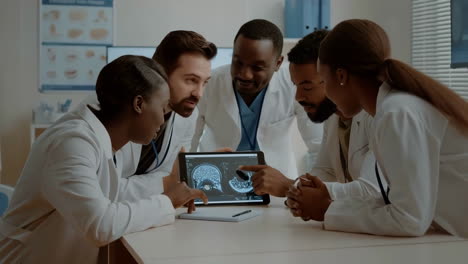 medical team collaborating on diagnosis with digital scans