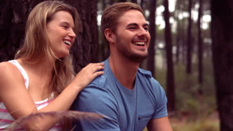 couple hiking through a forest