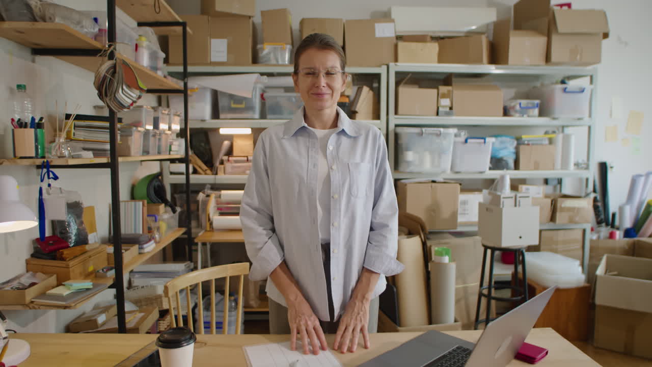 Portrait of Female Manager At Work in Delivery Service Warehouse