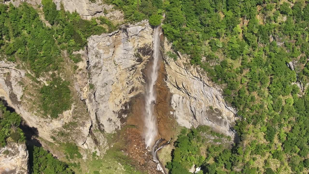 Beautiful aerial shot of Seerenbach Waterfalls in Amden, Switzerland, surrounded by green forests