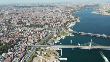 center of istanbul with train on bridge and car intersection traffic, aerial wide view over the city