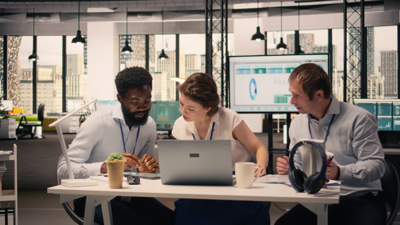 Diverse business team holding strategy briefing in modern office