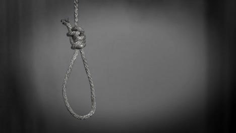 commit suicide concept, hangman's noose knot in dark room.