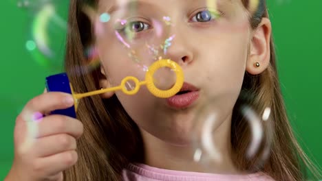 baby lets the soap bubbles green screen baby girl lets multicolored soap bubbles and sincere smiles green screen
