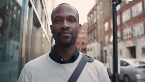 african american businessman walking through city