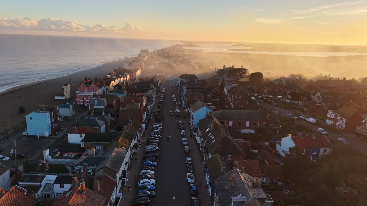 High street Aldeburgh Suffolk UK smoke drifting golden hour drone,aerial