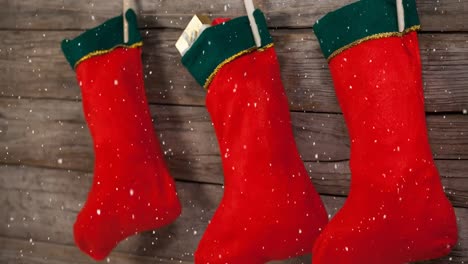 Falling-snow-with-Christmas-stockings-decoration