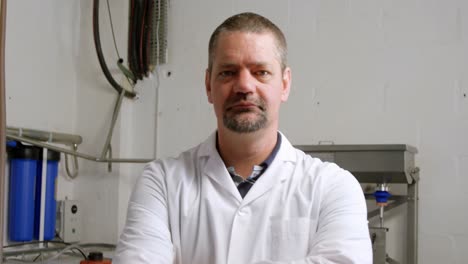 male worker standing in factory 4k