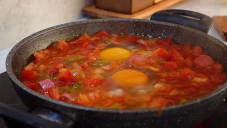 cooking menemen, turkish breakfast dish