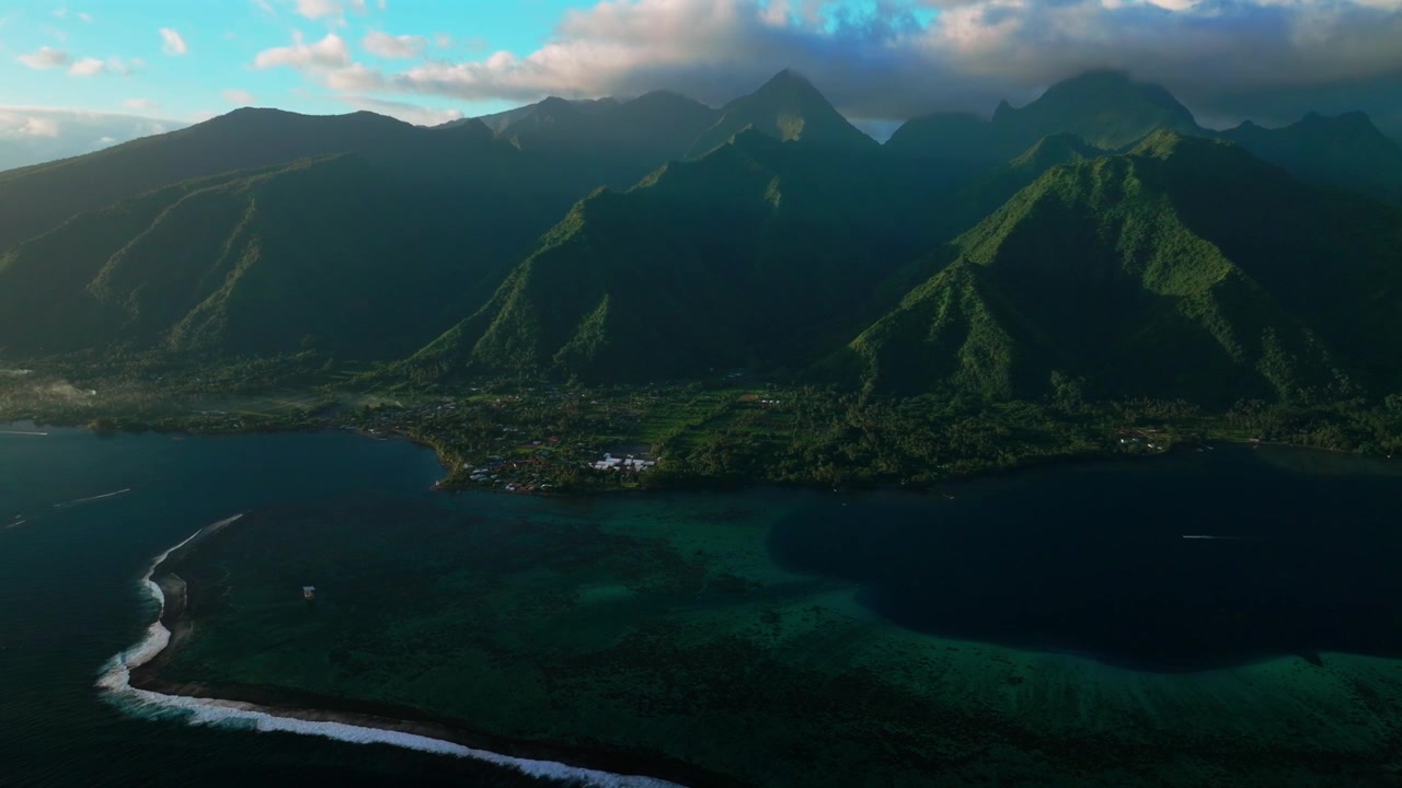 Tahiti lagoon landscape aerial drone harbor view French Polynesia Teahupo'o surf wave Passe Havea coral reef South Pacific Ocean island golden light rays volcano peaks beach coastline circle right