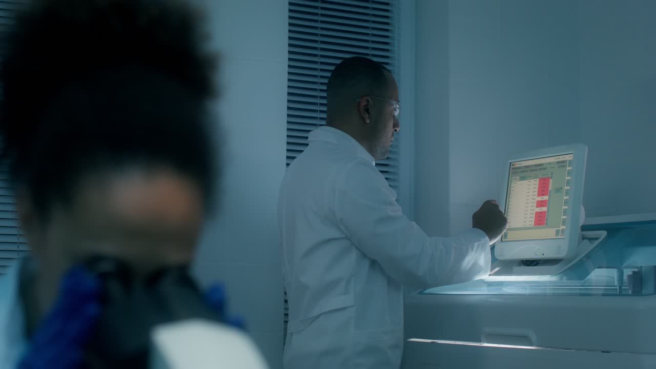 Scientist working on a lab machine