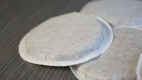 coffee pods on wooden surface