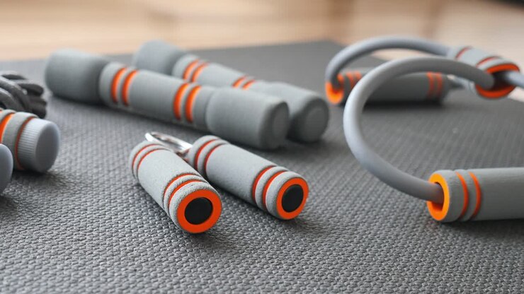 Gray and Orange Fitness Equipment on an Exercise Mat