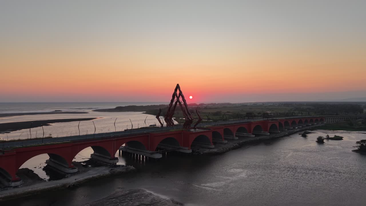 Aerial view of the Pandansimo Bridge at sunset, Bantul, Yogyakarta, as part of the southern ring road route of Java