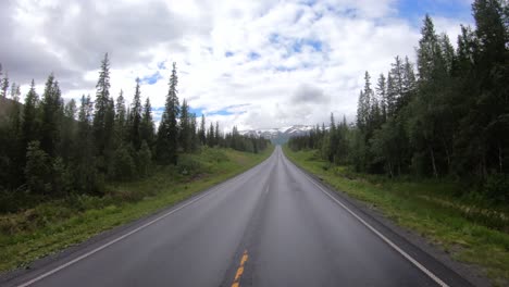 vehicle point-of-view driving a car on a road in norway