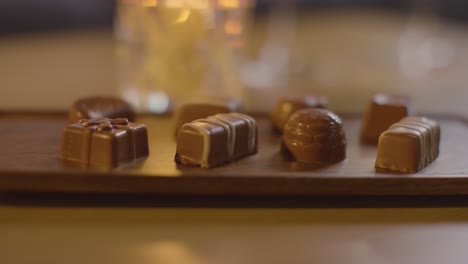 close up of chocolates on tray for valentines day on table