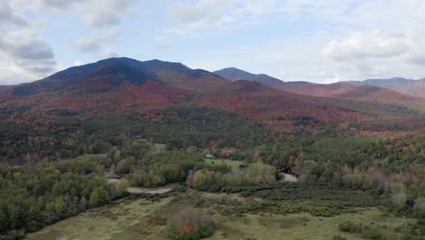 wide aerial view of a vast forest in keene valley in the adirondack mountains during the fall time