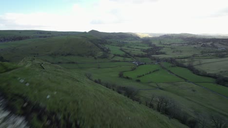 A-low-flyby-along-one-of-the-ridges-in-the-Peak-District,-a-beautiful-National-Park-in-England