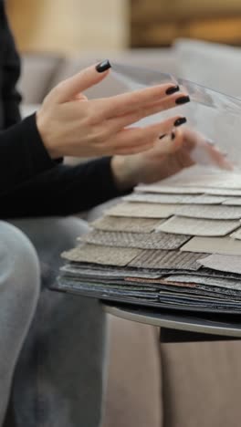 customer chooses a color in a furniture store discounts on goods black friday customer chooses a color in a furniture store discounts on goods black friday