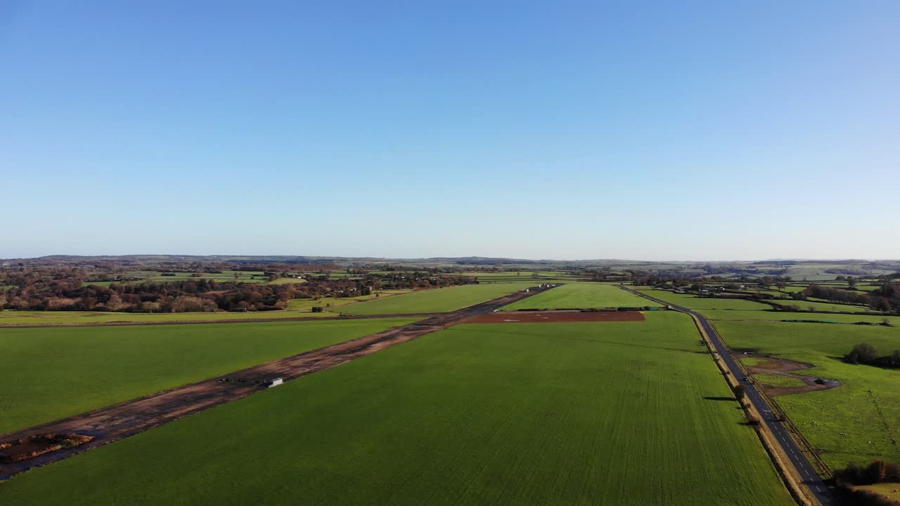 Aerial shot of the old airstrip of RAF Upottery at smeatharpe Devon England on a beautiful sunny summers day