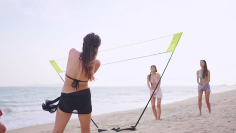 women playing beach volleyball