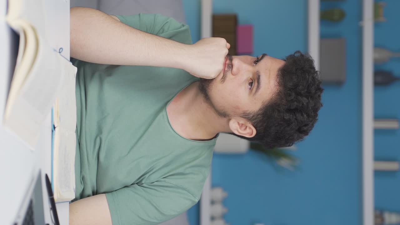Vertical video of Portrait of a nerdy male student.