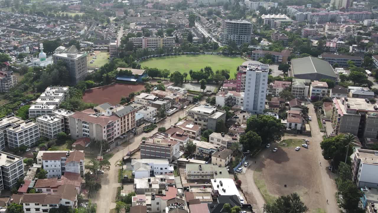 Aerial View of West Nairobi, Kenya, Residential Neighborhood and Green Circular Park on Sunny Day, 60fps Drone Shot