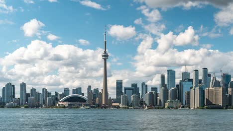 toronto, ontario, canada, dolly right timelapse sequence showing iconic toronto skyline and lake ontario by day during summer