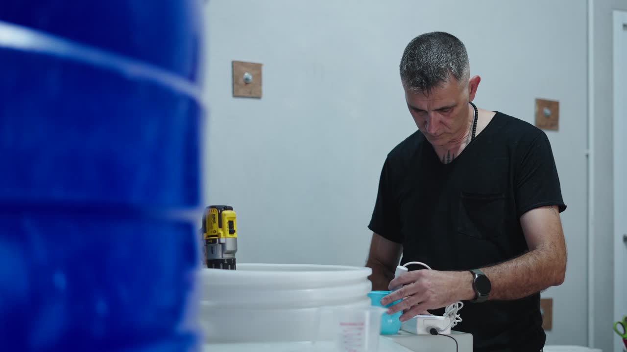 Man working on water tank maintenance