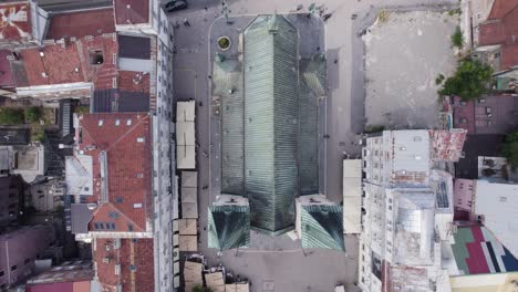 Aerial-top-view:-Sacred-Heart-Cathedral,-surrounded-by-Sarajevo's-urban-structures