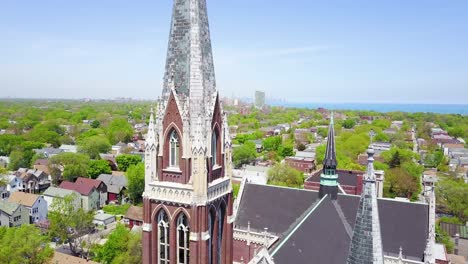 beautiful aerial around a church and steeple on the south side of chicago illinois 1