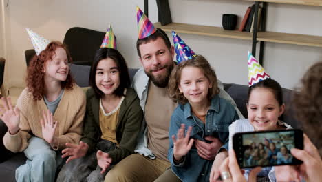 family and guests posing at home