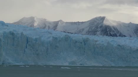 a wide shot of a glacier in distance