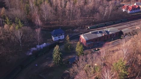 Aerial-chase-of-a-steam-train-in-Germany,-near-Zittau