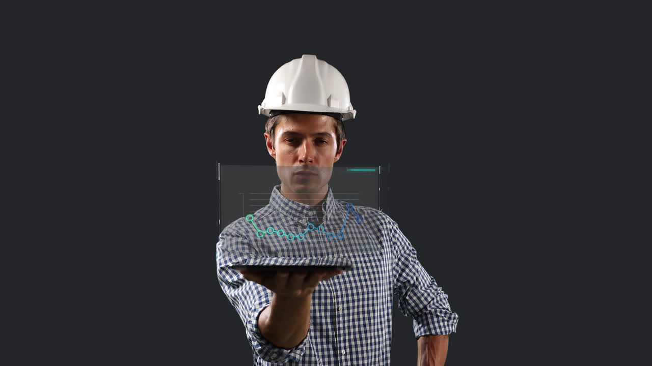 Caucasian male worker with a hard hat holding a tablet displaying a screen with statistics
