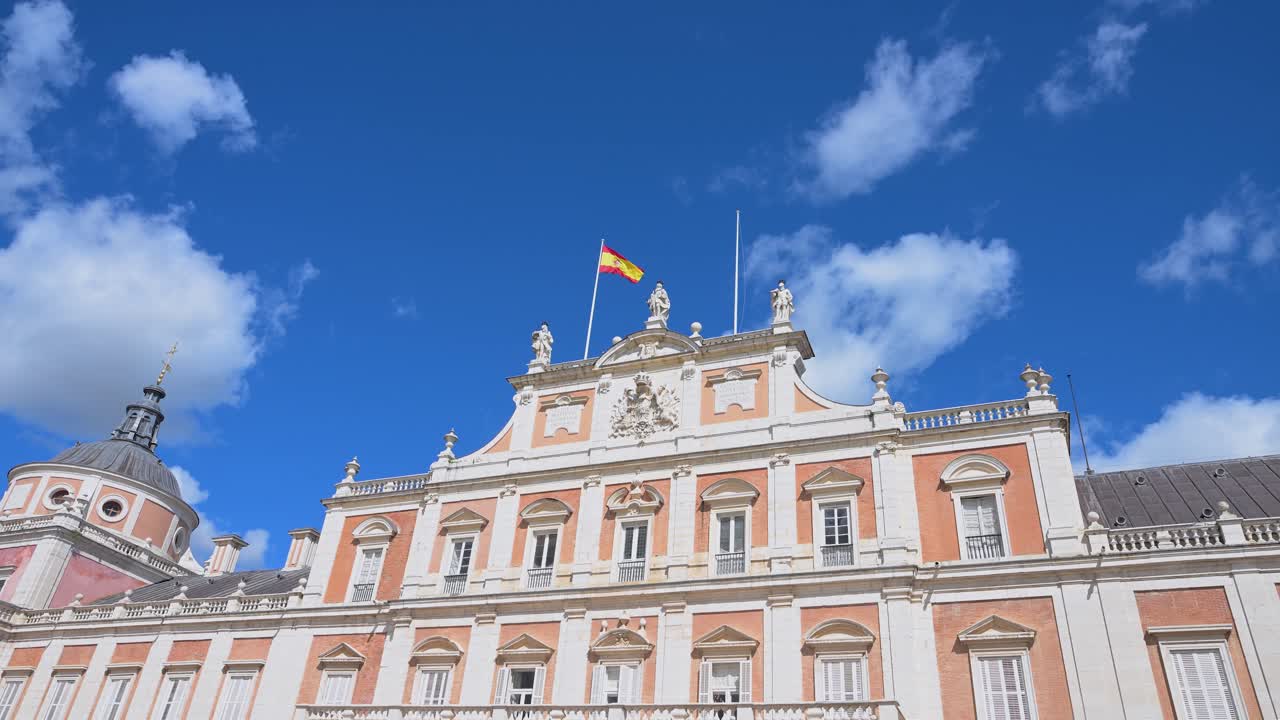 Spain's Aranjuez Royal Palace on a sunny day: An 18th-century royal residence, its grand architecture stands as a key tourist landmark and a testament to royal heritage.